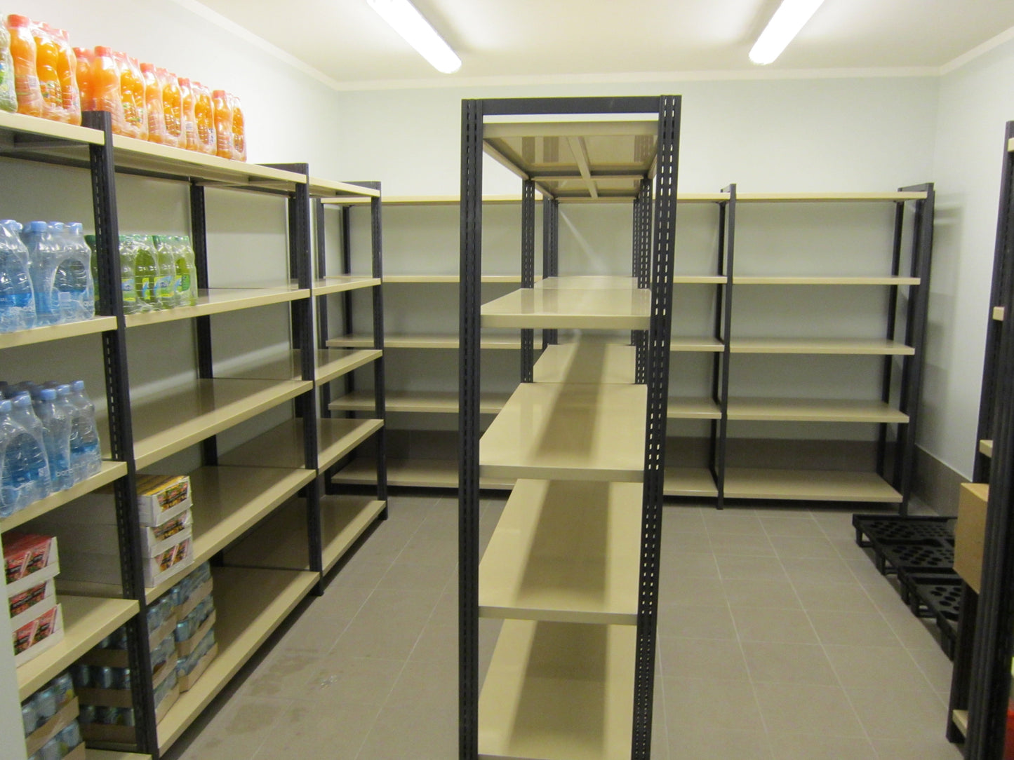LaFortezza Universal shelving in use in a shop stockroom, loaded with stock