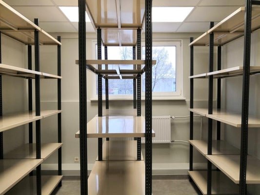 LaFortezza Universal shelving bays in a stockroom, anthracite uprights with Sahara shelves