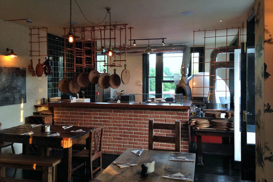 Pavesi Forni JOY 110 TW wood-fired rotating pizza oven installed in a restaurant